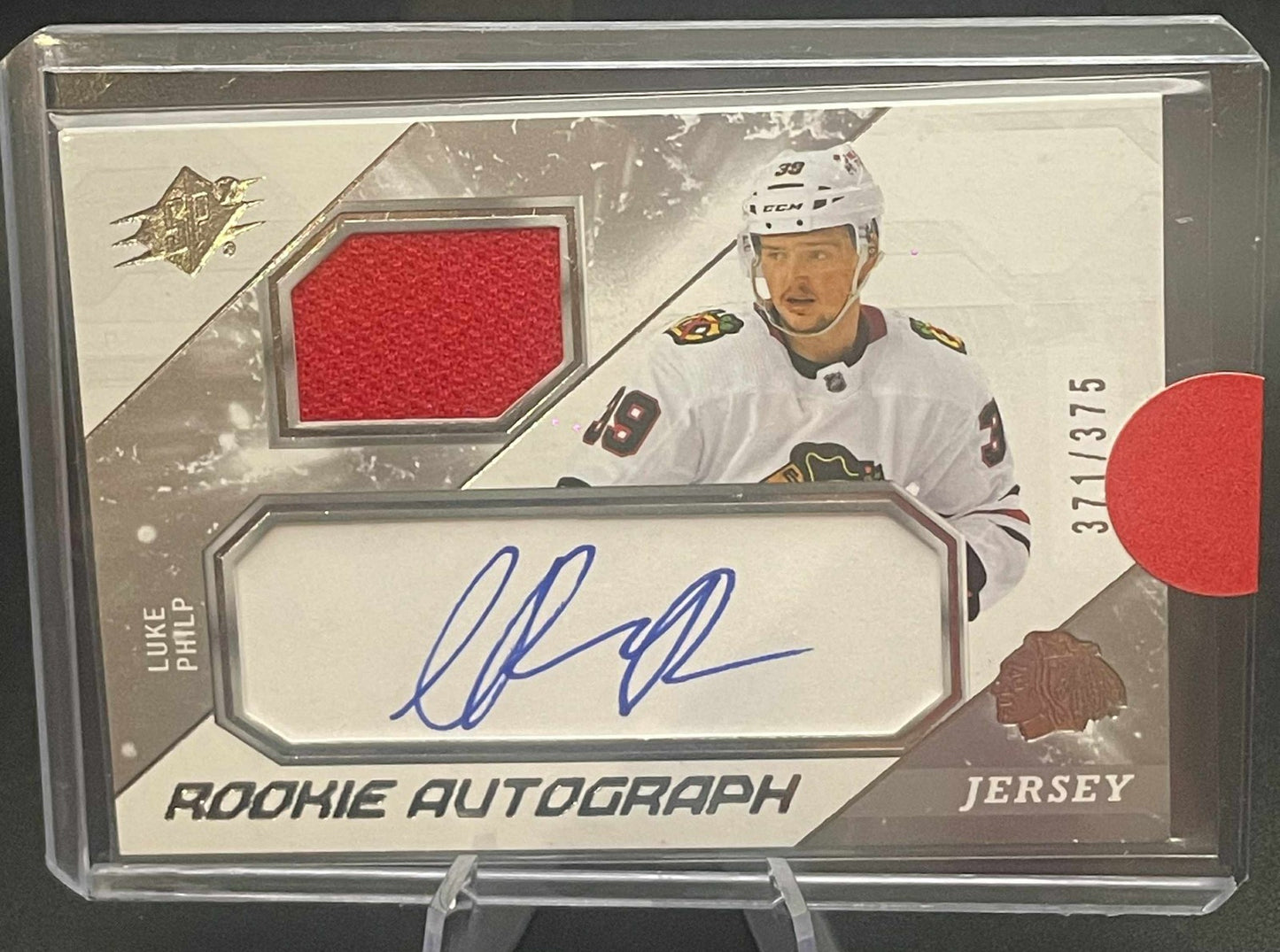 2023-24 SPx Rookie Auto Jersey /375 Luke Philp Rookie Auto Chicago Blackhawks