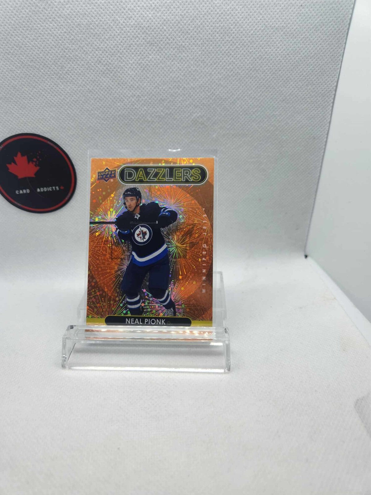 2021-22 Upper Deck Dazzlers Orange Neal Pionk #DZ-100 Jets