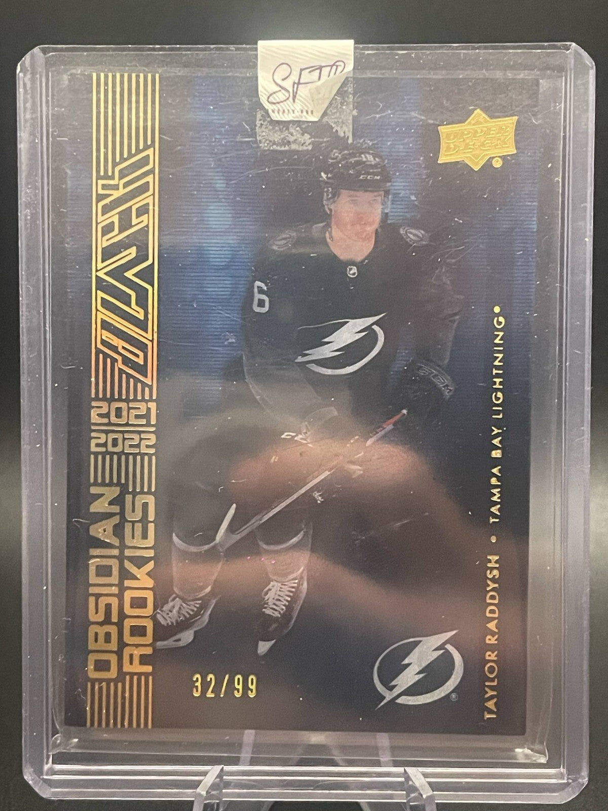 Taylor Raddysh 2021-22 UD Black #OR-44 Obsidian Rookies Black Gold #/99