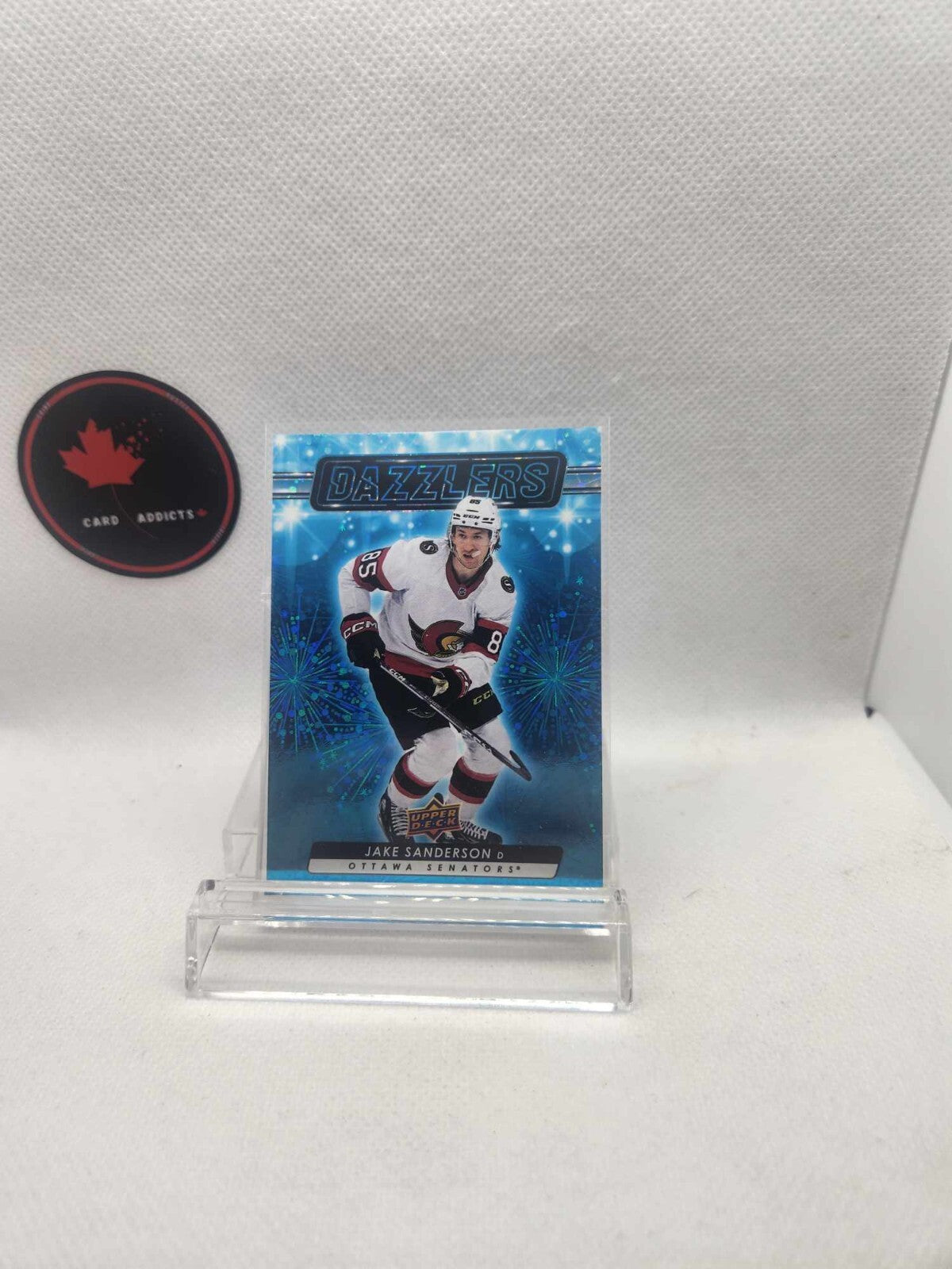 2023-24 Upper Deck Jake Sanderson Blue Dazzlers Card #DZ35. Ottawa Senators