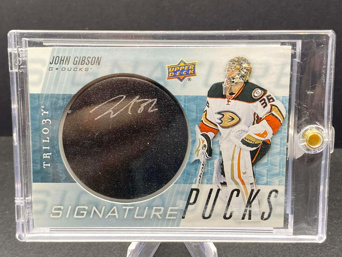 John Gibson "Signature Pucks" from 2016-17 Upper Deck Trilogy #SP-GI